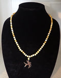 Golden mother of pearl dove necklace